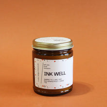 Load image into Gallery viewer, INK WELL Hand Poured Candle. Ambrette. Red Grapefruit. Sea Salt. Sage. Traditional Cotton Wick. Amber Jar.