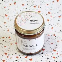 Load image into Gallery viewer, INK WELL Hand Poured Candle. Ambrette. Red Grapefruit. Sea Salt. Sage. Traditional Cotton Wick. Amber Jar.