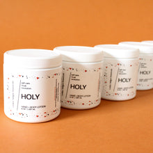 Load image into Gallery viewer, HOLY Hand and Body Lotion. Argan Oil. Sunflower OIl. Carnation. Sandalwood. Musk. 8 oz. SALE