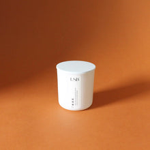 Load image into Gallery viewer, B D E Hand Poured Candle. Leather. Ginger. Cedar. Scotch. Coconut. Vetiver. Purple Basil. 8 oz.