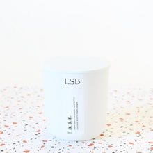 Load image into Gallery viewer, B D E Hand Poured Candle. Leather. Ginger. Cedar. Scotch. Coconut. Vetiver. Purple Basil. 8 oz.