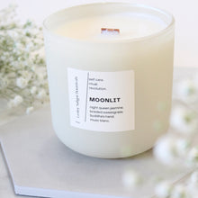 Load image into Gallery viewer, MOONLIT Hand Poured Candle. Night Queen Jasmine. Braided Sweetgrass. Buddha's Hand. Musc Blanc. Wood Wick. 14 oz. Matte Cream. Large.