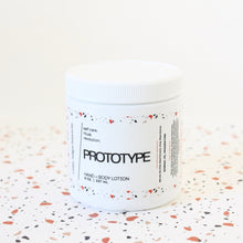 Load image into Gallery viewer, PROTOTYPE Hand and Body Lotion. Marula Oil. Chia Seed Extract. Shea. Aloe. Sweet Cream. Cardamom. Sandalwood. 8 oz.