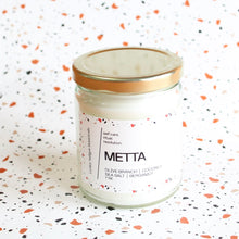 Load image into Gallery viewer, METTA Hand Poured Candle. Olive Branch. Coconut. Bergamot. Cassis. Coriander. Salt Air. Thyme. 7 oz. Cotton Wick.