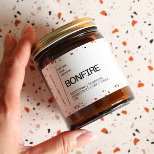 BONFIRE Hand Poured Candle. Cedarwood. Charcoal. Dried Fruit. Tonka. Leather. Amber Jar. 7 oz. Cotton Wick.