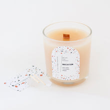 Load image into Gallery viewer, BAECATION Hand Poured Candle. Pina Colada Scent. Papaya. Cocoa Butter. Gold Shimmer. Wood Wick. 12 oz. Clear Vessel.
