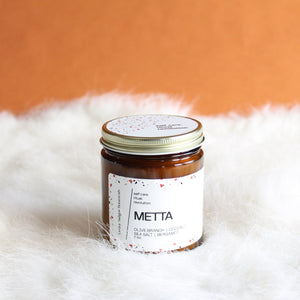 METTA Hand Poured Candle. Olive Branch. Coconut. Bergamot. Cassis. Coriander. Salt Air. Thyme. 7 oz. Traditional Cotton Wick.