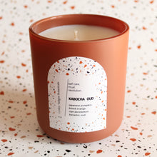 Load image into Gallery viewer, KABOCHA OUD Hand Poured Candle. Blood Orange. Japanese Kabocha Pumpkin. Allspice. Brown Sugar. Wood Wick. 12 oz. Matte Terracotta.