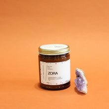 Load image into Gallery viewer, ZORA Hand Poured Candle. Lavender. Pine. Orange. Lemongrass. Cashmere. Musk. 7 oz. Traditional Cotton Wick. Amber Jar.