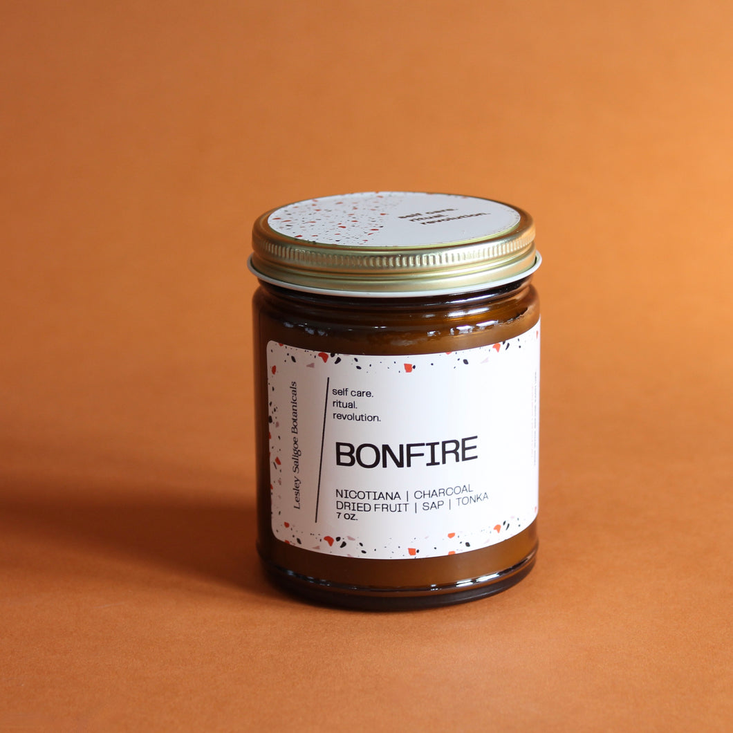 BONFIRE Hand Poured Candle. Cedarwood. Charcoal. Dried Fruit. Tonka. Leather. Amber Jar. 7 oz. Cotton Wick.