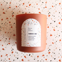 Load image into Gallery viewer, KABOCHA OUD Hand Poured Candle. Blood Orange. Japanese Kabocha Pumpkin. Allspice. Brown Sugar. Wood Wick. 12 oz. Matte Terracotta.